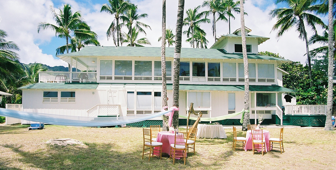 Hawaii estate house with wedding tables set up on the lawn